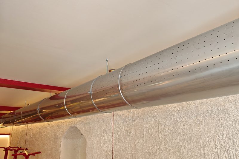 Perforated ventilation duct, seen along the ceiling
